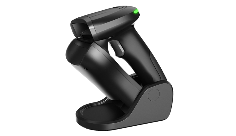 Handheld scanner di codici a barre on a table.